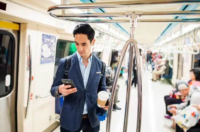 Business person on train on phone