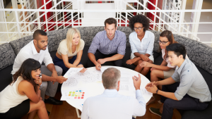 Leader in meeting with team